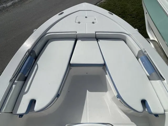 Slide: The Image of 2024 Robalo 206 Cayman boat bow seating area with cushioned seats. - 21