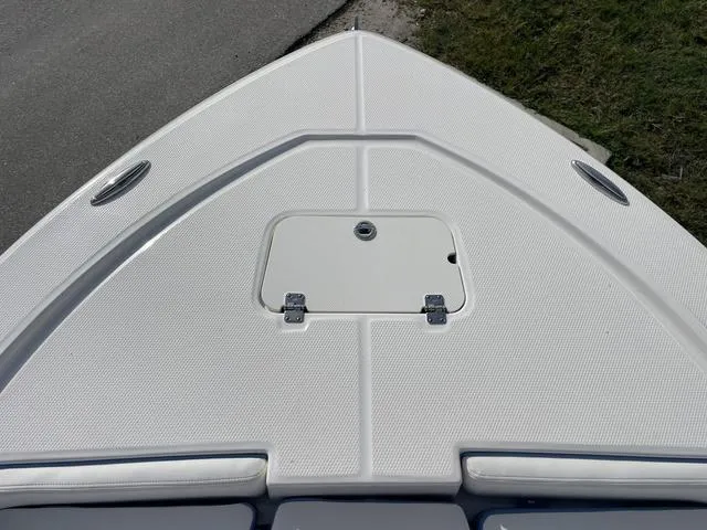 Slide: The Image of Bow deck of 2024 Robalo 206 Cayman boat with storage hatch. - 22