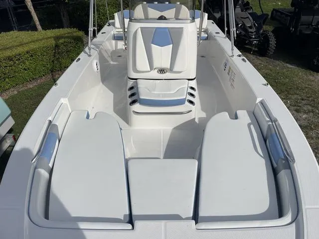 Slide: The Image of 2024 Robalo 206 Cayman boat interior with seating and storage compartments. - 23