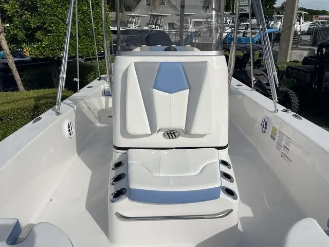 Slide: The Image of 2024 Robalo 206 Cayman boat interior with white seating and console. - 24