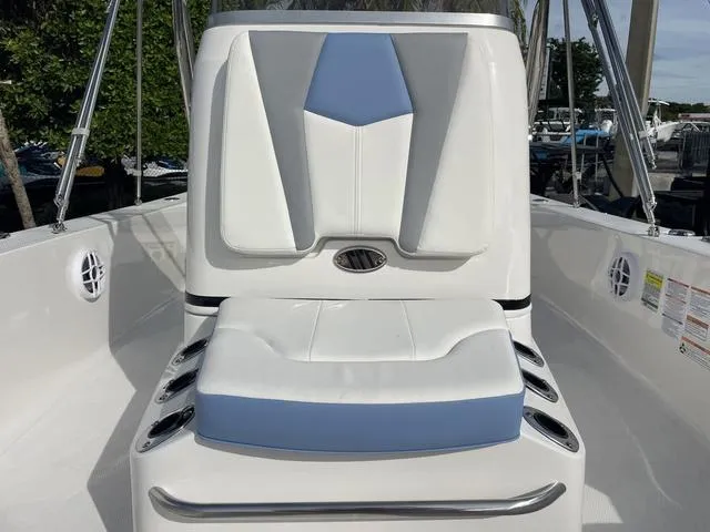 Slide: The Image of 2024 Robalo 206 Cayman boat seat with blue and white upholstery. - 25