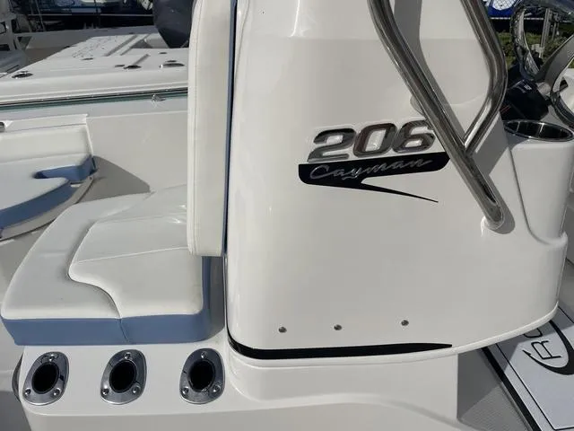 Slide: The Image of 2024 Robalo 206 Cayman boat interior with seating and console details. - 31