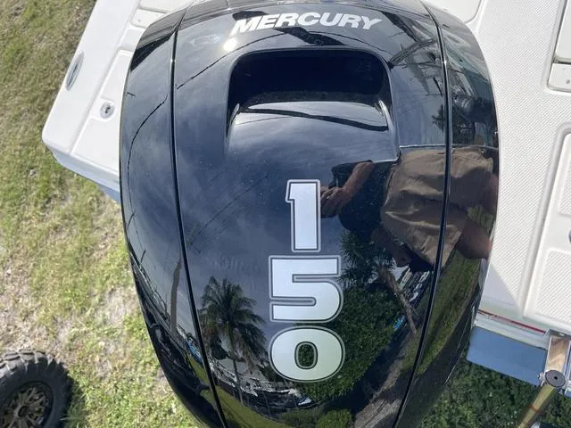 Slide: The Image of Mercury 150 outboard motor on a 2024 Robalo 206 Cayman boat. - 38