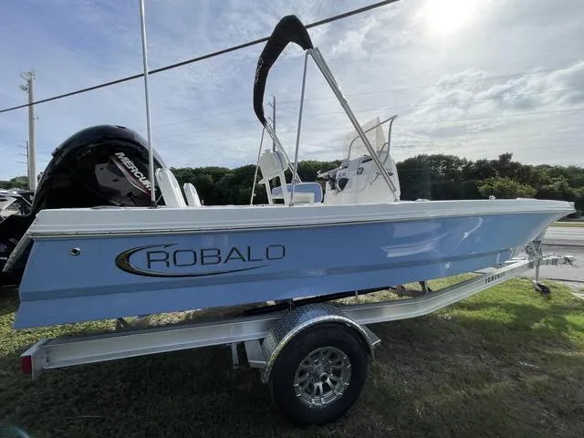 Slide: The Image of 2024 Robalo 206 Cayman boat on a trailer, side view. - 5
