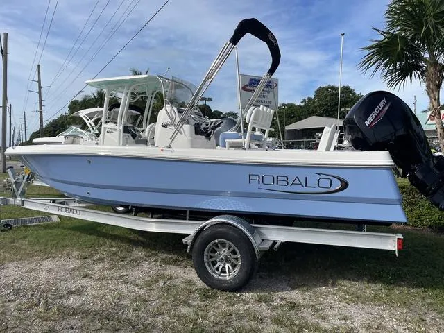 Slide: The Image of 2024 Robalo 206 Cayman boat on trailer with Mercury outboard motor. - 7