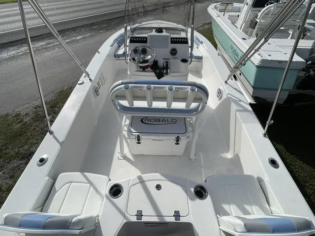 Slide: The Image of 2024 Robalo 206 Cayman boat interior with console and seating. - 9