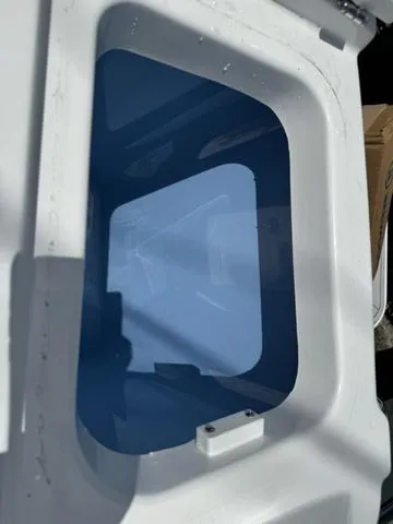 Slide: The Image of 2024 Blackfin 302DC boat storage compartment with blue interior. - 11