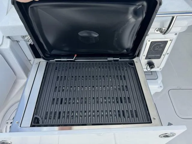 Slide: The Image of 2024 Blackfin 302DC boat with Kenyon grill. - 13