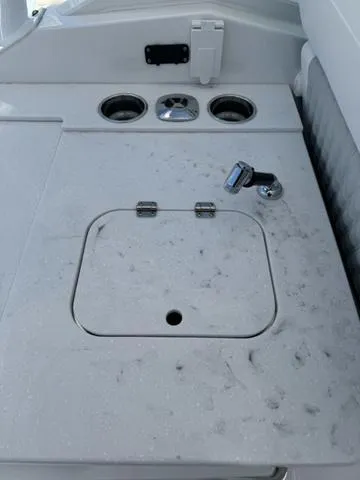 Slide: The Image of 2024 Blackfin 302DC boat sink and countertop area. - 15