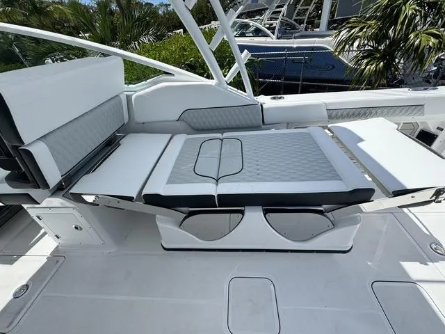 Slide: The Image of 2024 Blackfin 302DC boat interior with white and gray seating. - 19