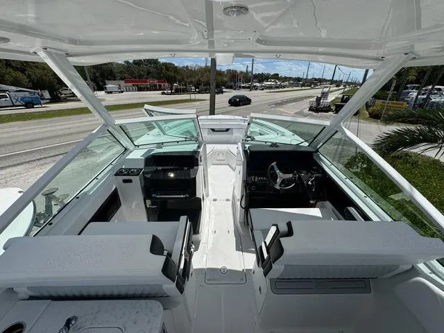 Slide: The Image of 2024 Blackfin 302DC boat interior with seating and helm station. - 21