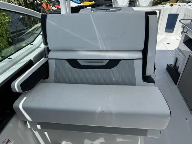 Slide: The Image of 2024 Blackfin 302DC boat interior seating with modern design and premium upholstery. - 27