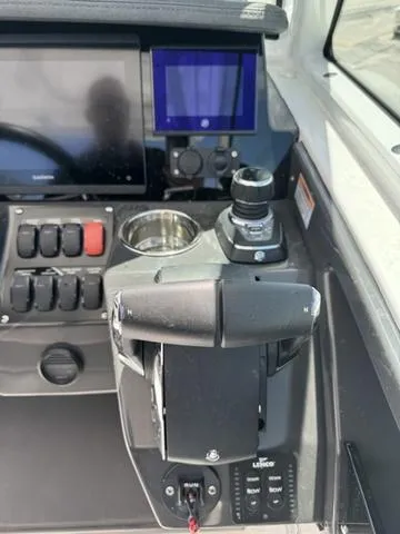 Slide: The Image of 2024 Blackfin 302DC boat dashboard with control panel and navigation screens. - 29