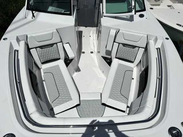 Slide: The Image of 2024 Blackfin 302DC boat with spacious seating area and modern design. - 38
