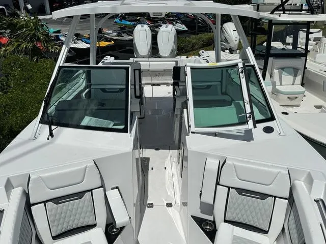 Slide: The Image of 2024 Blackfin 302DC boat with open cockpit and seating area. - 39