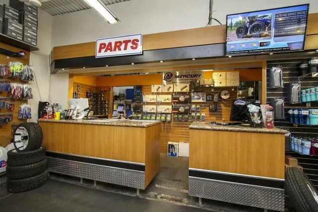 Slide: The Image of Boat parts store interior with counter, shelves, and Mercury Marine products. - 47