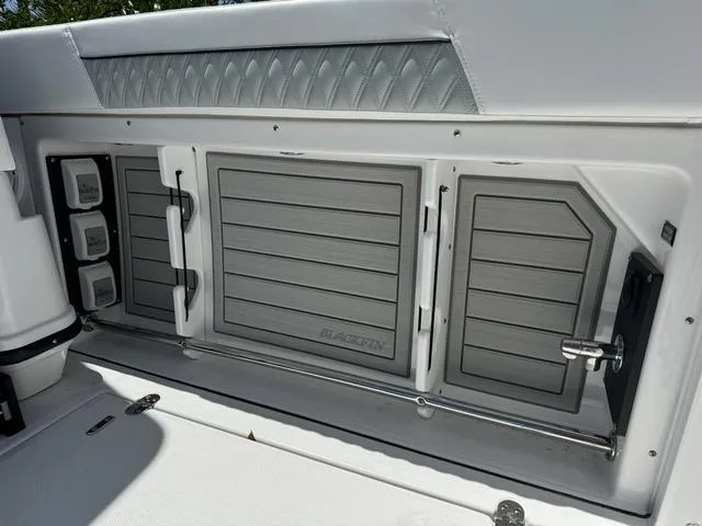 Slide: The Image of 2024 Blackfin 302DC boat storage compartments and seating area. - 6