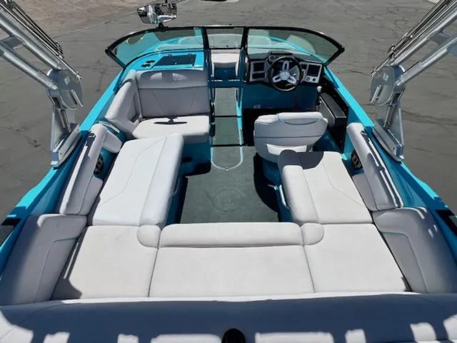 Slide: The Image of 2019 MasterCraft NXT20 boat interior with white seating and blue accents. - 10