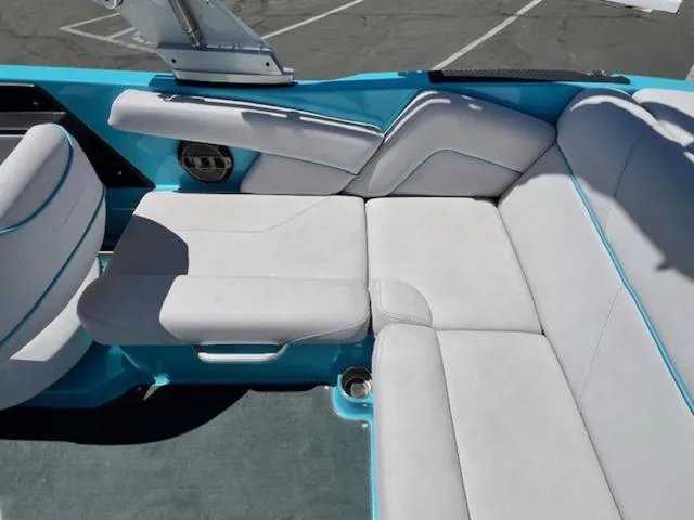Slide: The Image of 2019 MasterCraft NXT20 boat interior with white and blue seating. - 15
