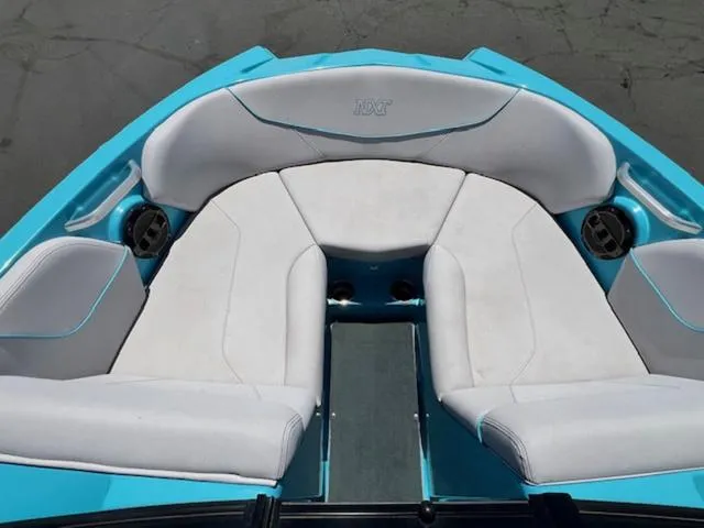 Slide: The Image of 2019 MasterCraft NXT20 boat interior with white and blue seating. - 16
