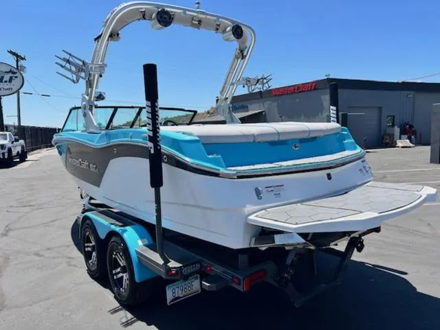Slide: The Image of 2019 MasterCraft NXT20 boat on trailer, rear view. - 8