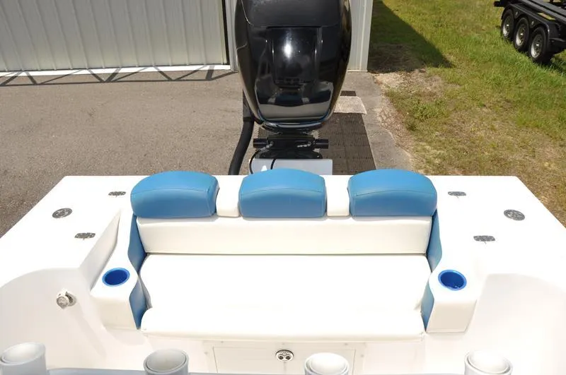 Slide: The Image of 2009 Concept 27' CC boat with blue and white seating and outboard motor. - 10