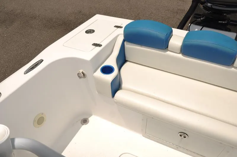 Slide: The Image of 2009 Concept 27' CC boat interior with blue and white seating and cup holder. - 11