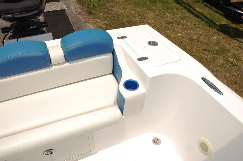 Slide: The Image of 2009 Concept 27' CC boat interior with blue and white seating and cup holder. - 12
