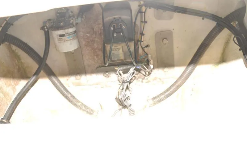 Slide: The Image of 2009 Concept 27' CC boat engine compartment with wiring and filter. - 14
