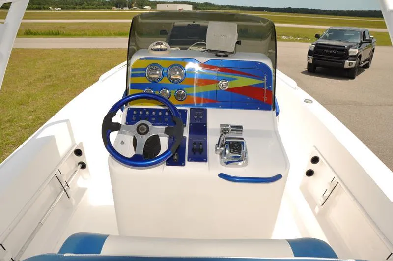 Slide: The Image of 2009 Concept 27' CC boat dashboard with colorful design and steering wheel. - 18