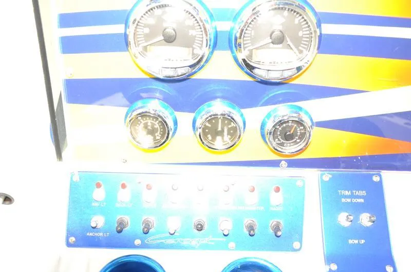 Slide: The Image of Dashboard of a 2009 Concept 27' CC boat with gauges and control switches. - 19