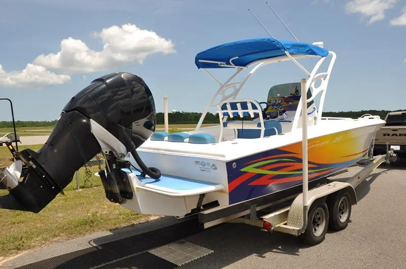Slide: The Image of 2009 Concept 27' CC boat with colorful graphics on a trailer. - 2
