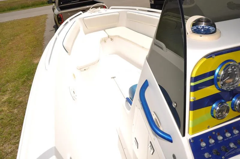 Slide: The Image of 2009 Concept 27' CC boat interior with white seating and blue dashboard. - 22