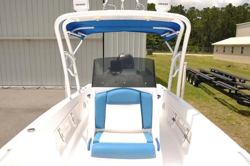 Slide: The Image of 2009 Concept 27' CC boat with blue and white seating and canopy. - 26