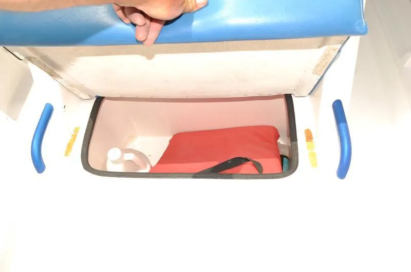 Slide: The Image of Storage compartment of a 2009 Concept 27' CC boat with life jacket and bottle. - 27