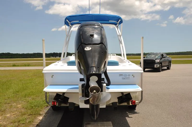 Slide: The Image of 2009 Concept 27' CC boat with outboard motor and blue canopy. - 3