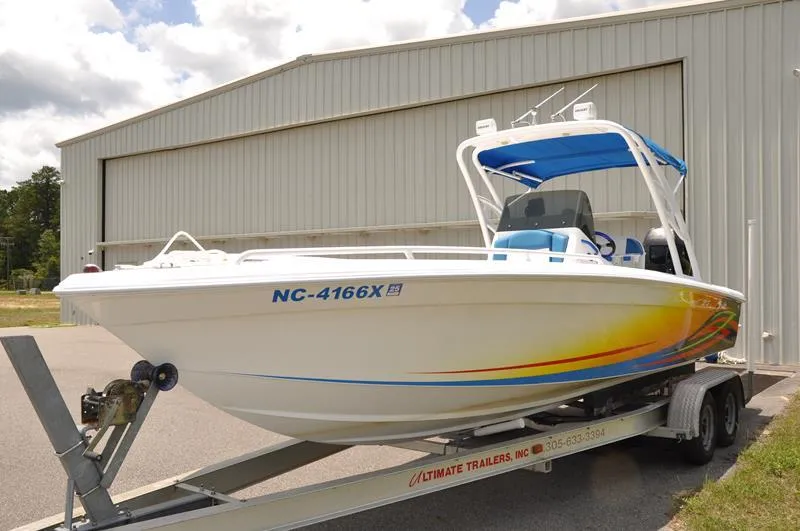 Slide: The Image of 2009 Concept 27' CC boat on trailer outside a large building. - 6