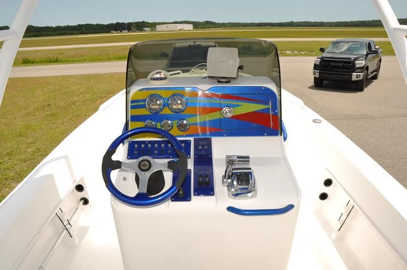Slide: The Image of 2009 Concept 27' CC boat dashboard with steering wheel and control panel. - 8