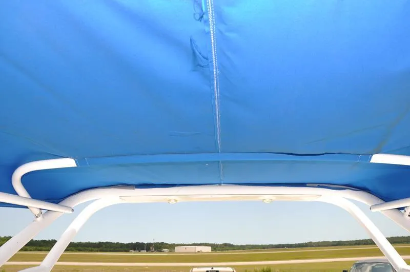 Slide: The Image of 2009 Concept 27' CC boat with blue canopy and white frame. - 9