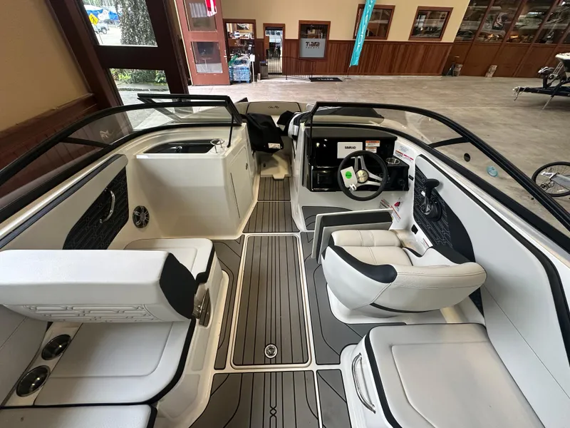 Slide: The Image of 2024 Sea Ray SPX 210 boat interior with modern seating and sleek design. - 13