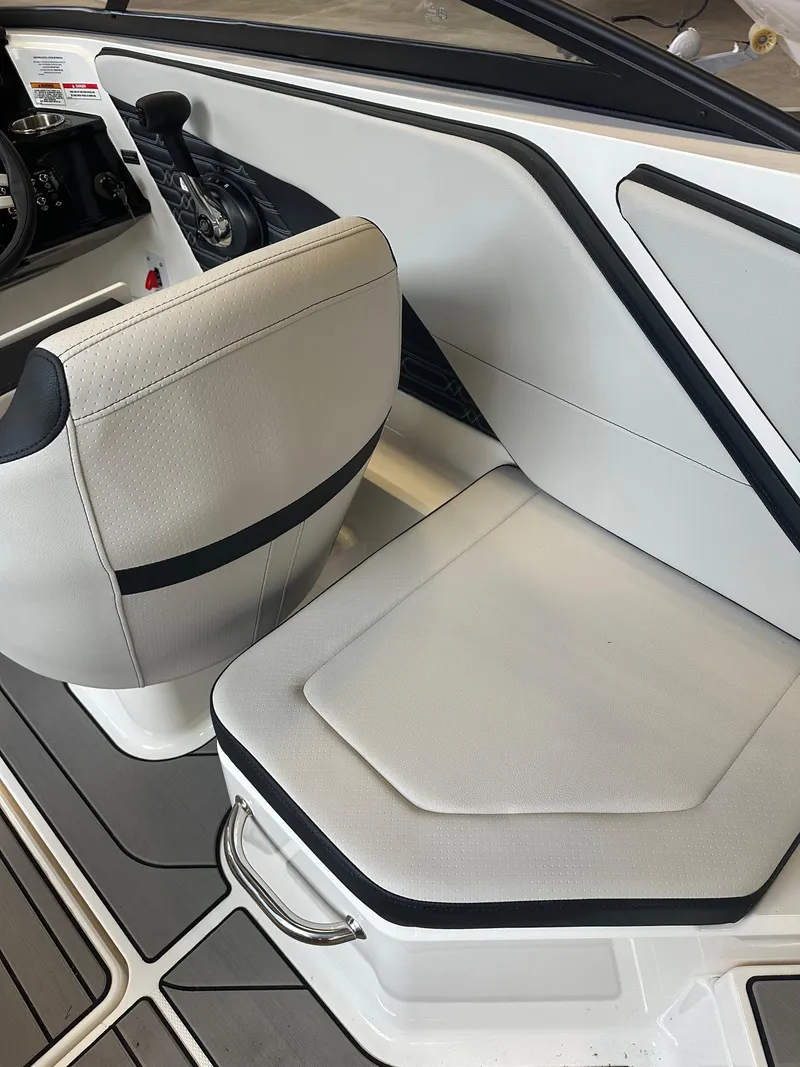 Slide: The Image of 2024 Sea Ray SPX 210 boat interior with sleek seating and modern design. - 15