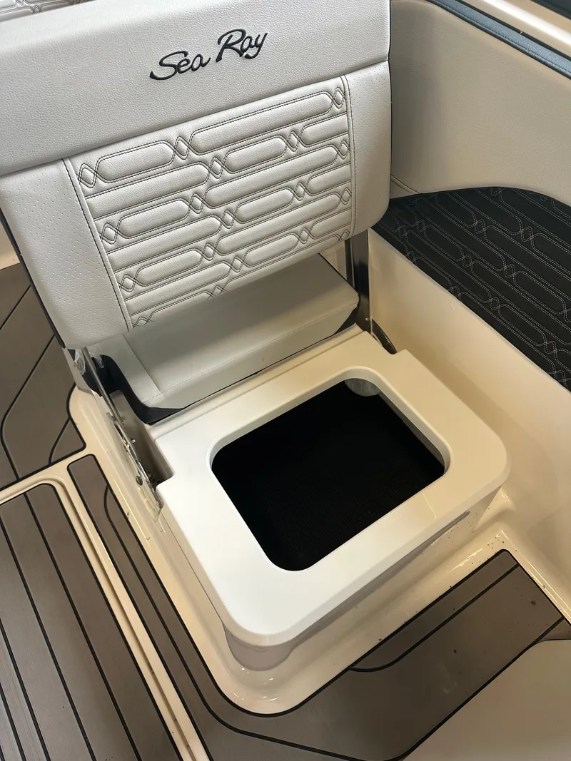 Slide: The Image of 2024 Sea Ray SPX 210 boat seat with storage compartment, featuring elegant stitching. - 25