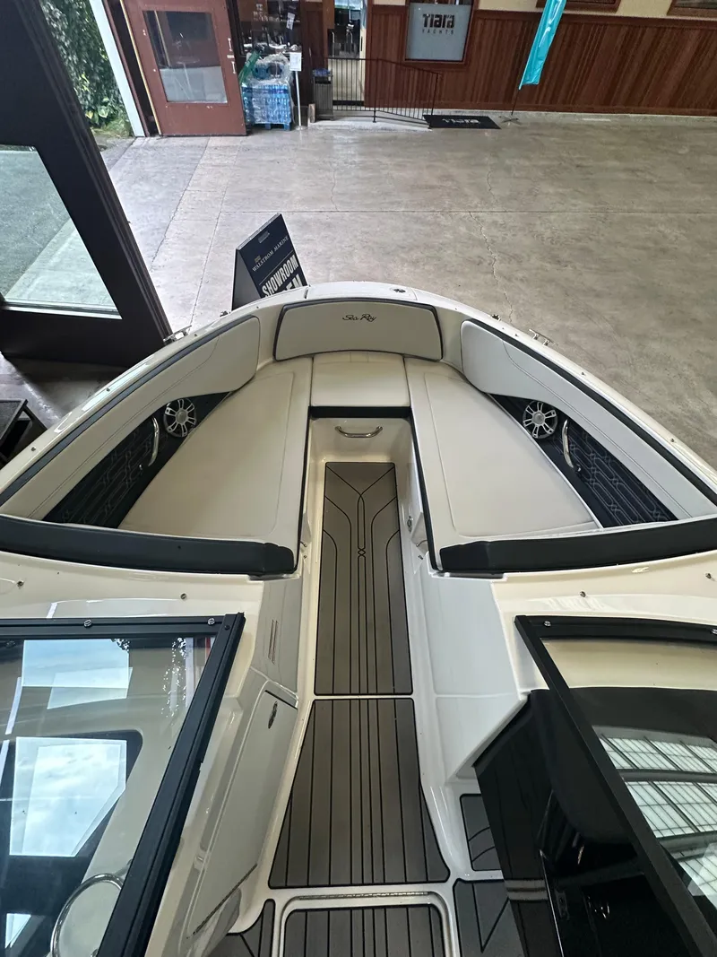Slide: The Image of 2024 Sea Ray SPX 210 boat interior with sleek seating and modern design. - 26
