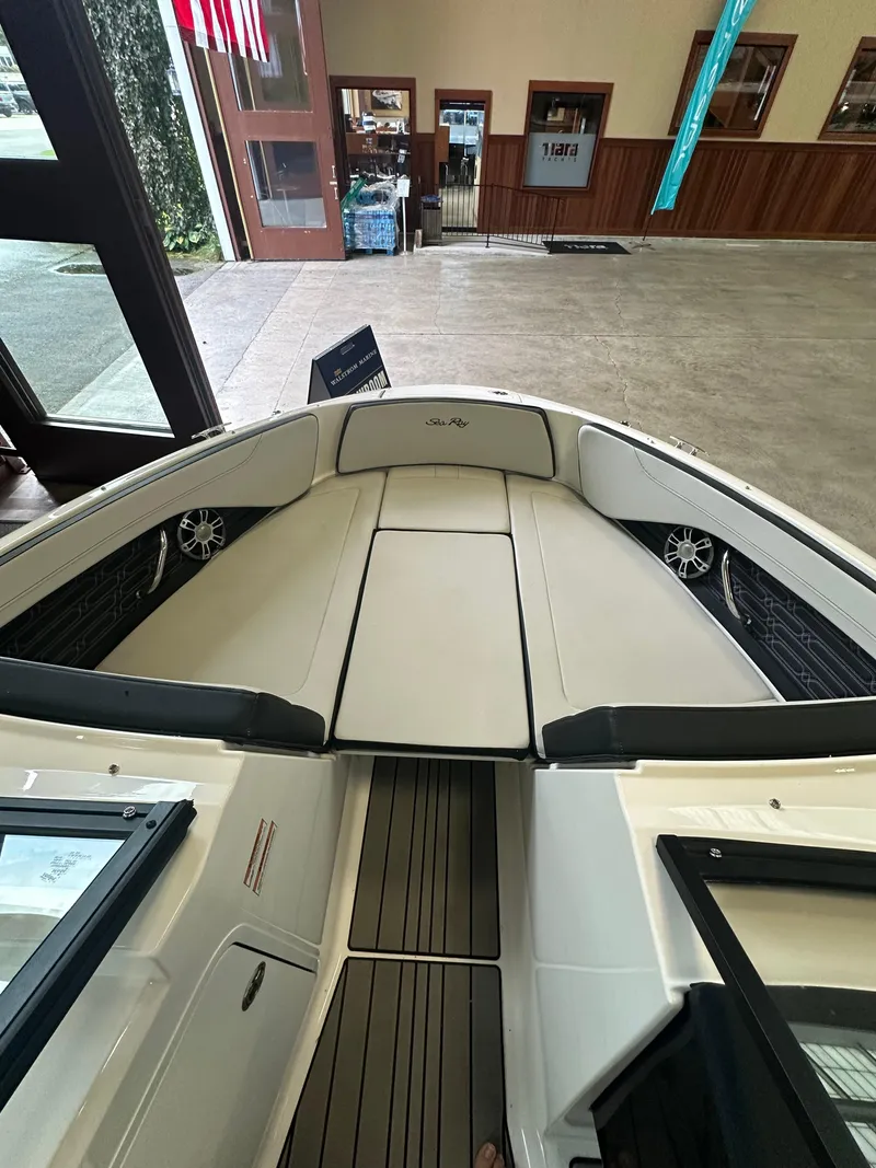 Slide: The Image of 2024 Sea Ray SPX 210 boat interior with spacious seating and modern design. - 29