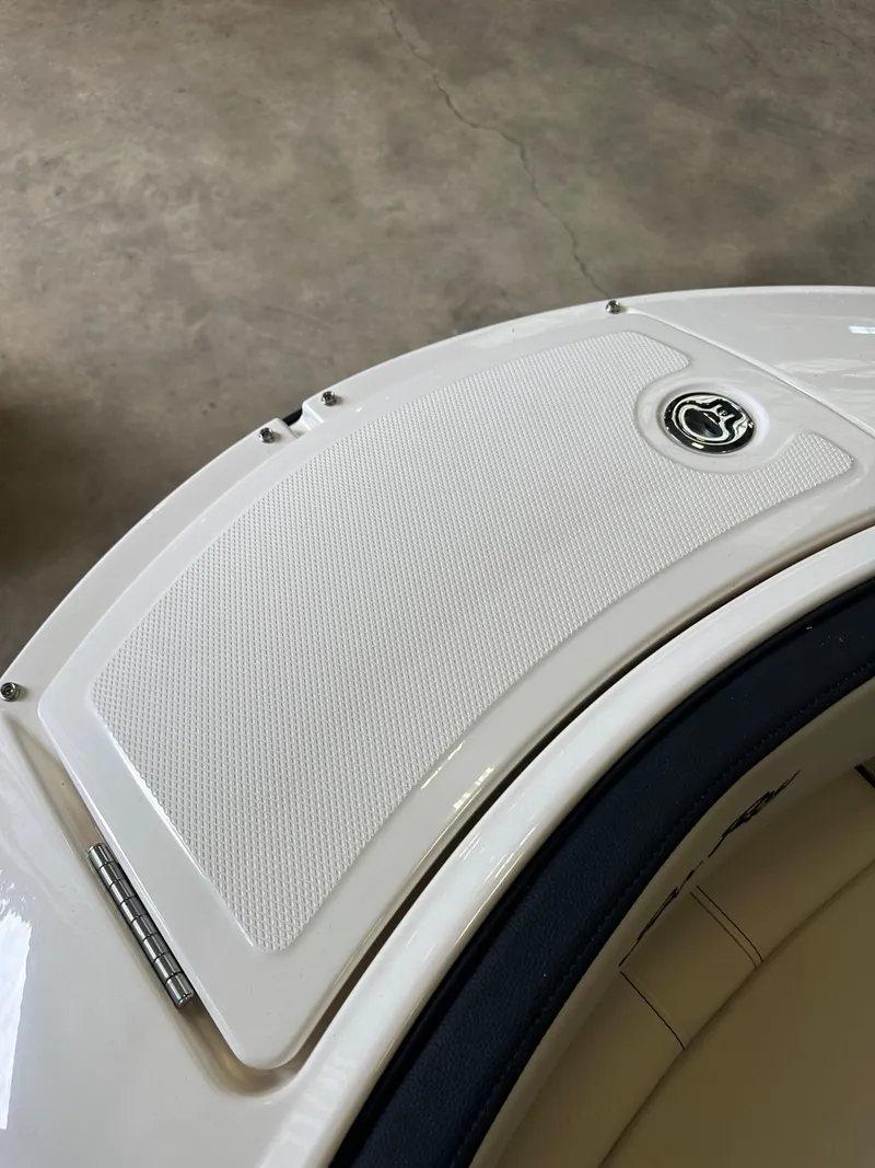 Slide: The Image of 2024 Sea Ray SPX 210 boat deck with logo, featuring sleek white design. - 33