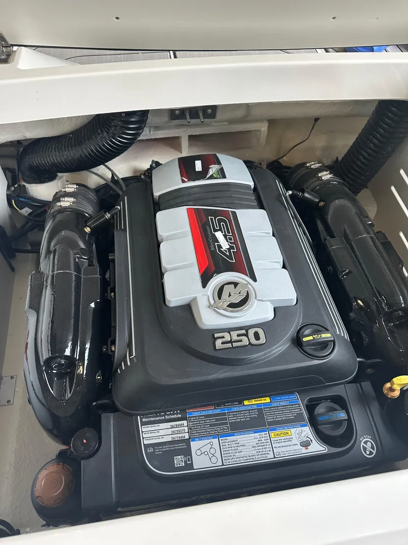 Slide: The Image of 2024 Sea Ray SPX 210 engine compartment showcasing powerful 250 horsepower engine. - 6