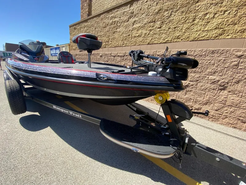Slide: The Image of 2024 Ranger Z520R Ranger Cup Equipped boat on trailer, parked outdoors. - 3