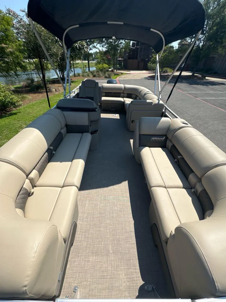 Slide: The Image of 2024 Sun Tracker Party Barge 20 DLX pontoon boat with spacious seating and canopy. - 4
