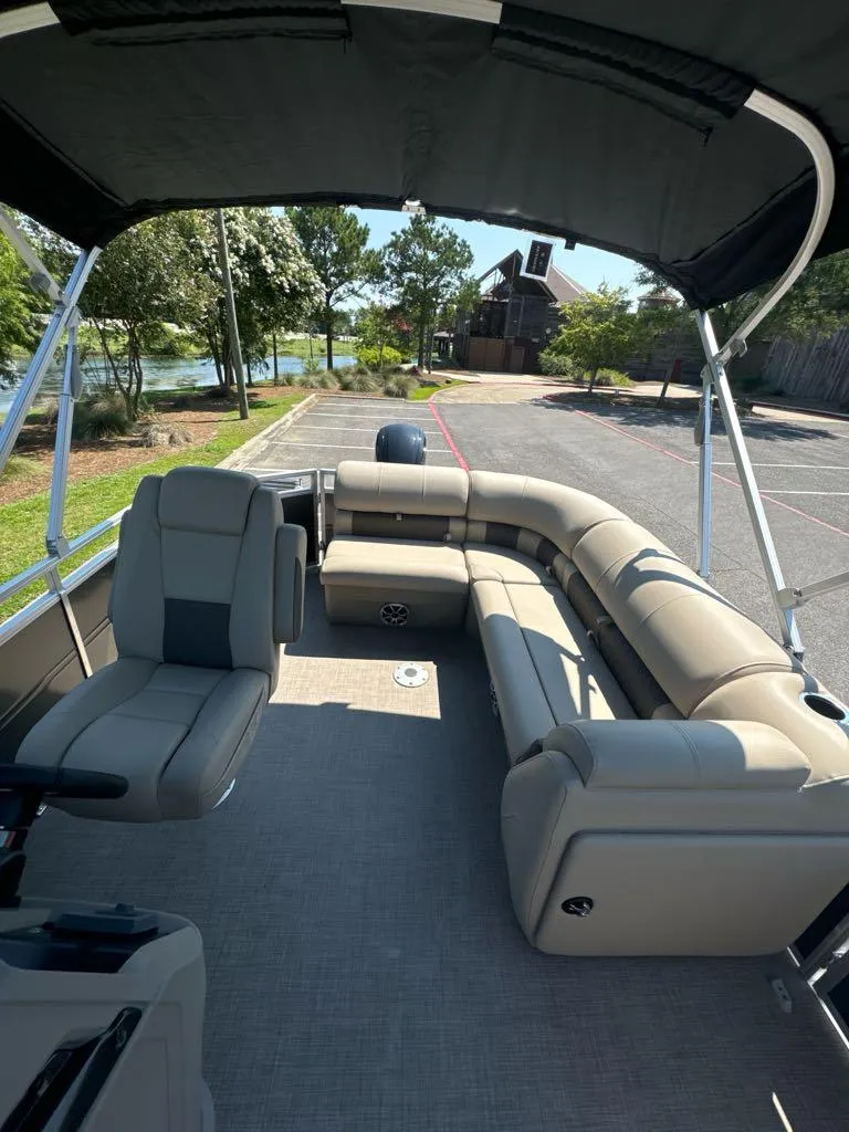 Slide: The Image of 2024 Sun Tracker Party Barge 20 DLX pontoon boat with spacious seating and canopy. - 6