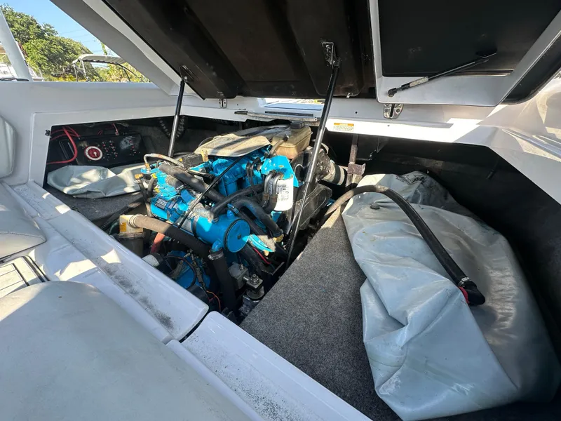 Slide: The Image of 2010 Nautique Super Air Nautique 230 engine compartment with open hatch. - 14